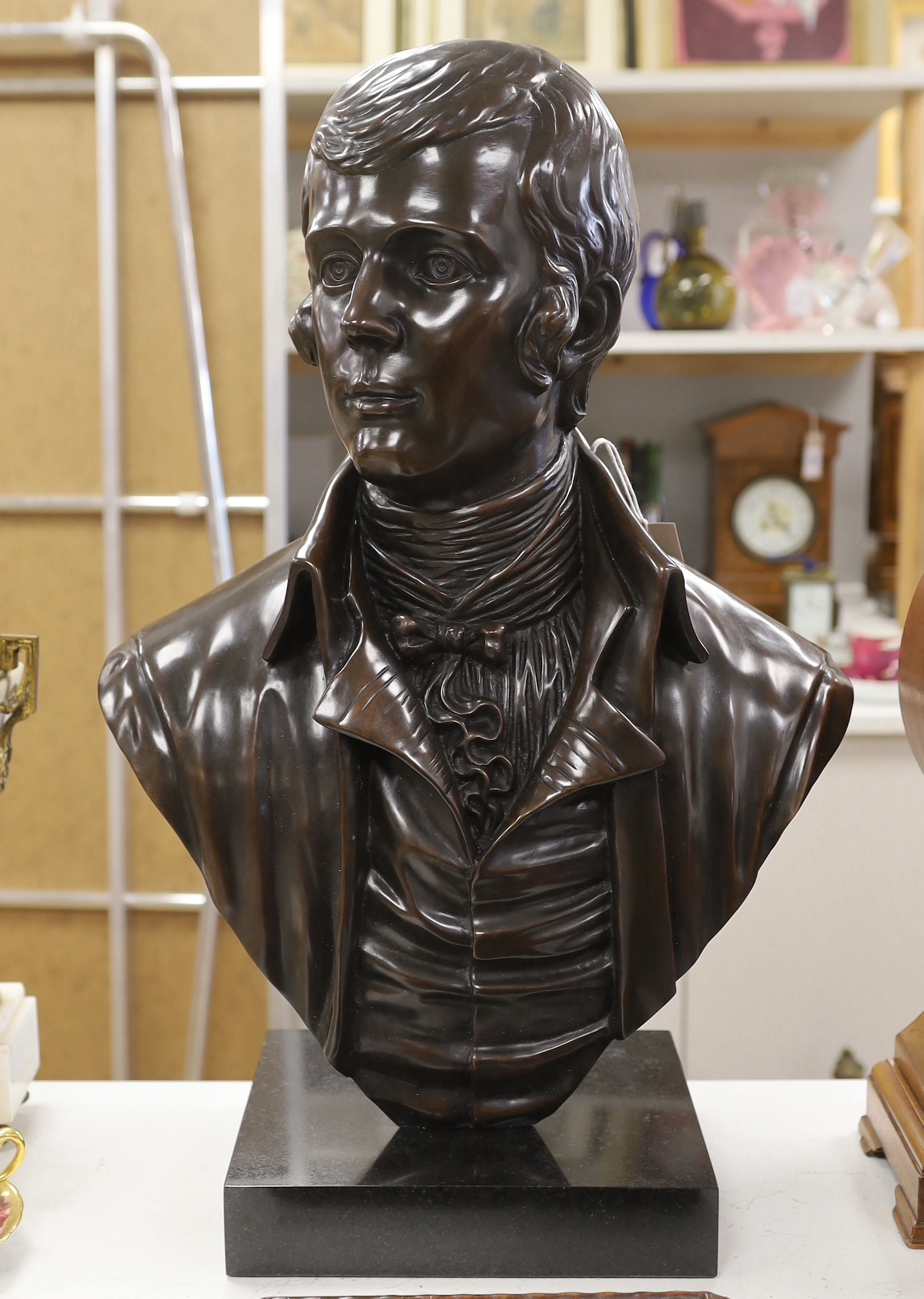 A bronze bust of Robert Burns, signed Cornell, 61cm